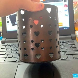 A pencil/candle holder